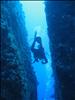 Julie Dives Through Split Rock in Tonga